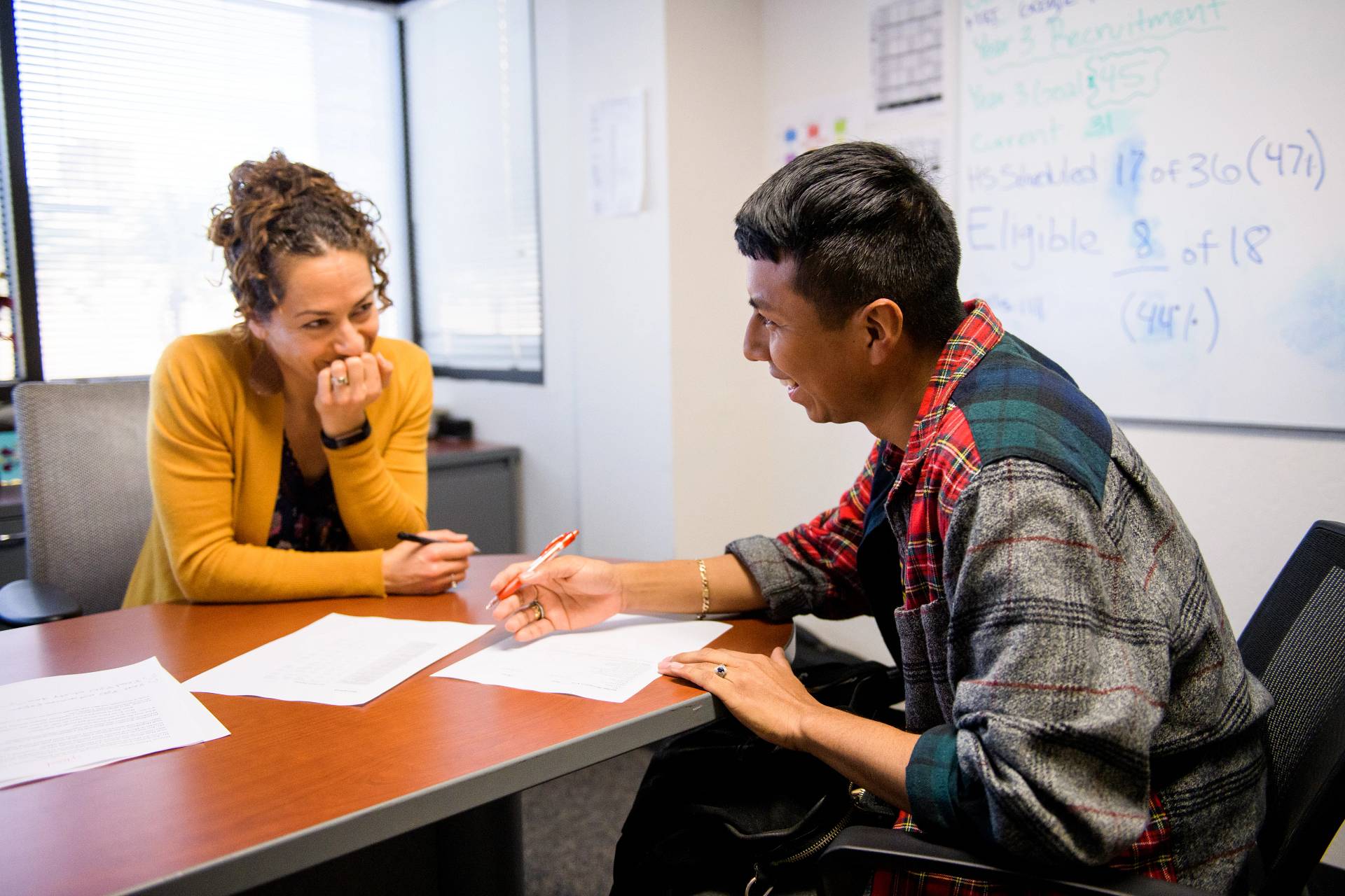 Student and teacher review an assignment