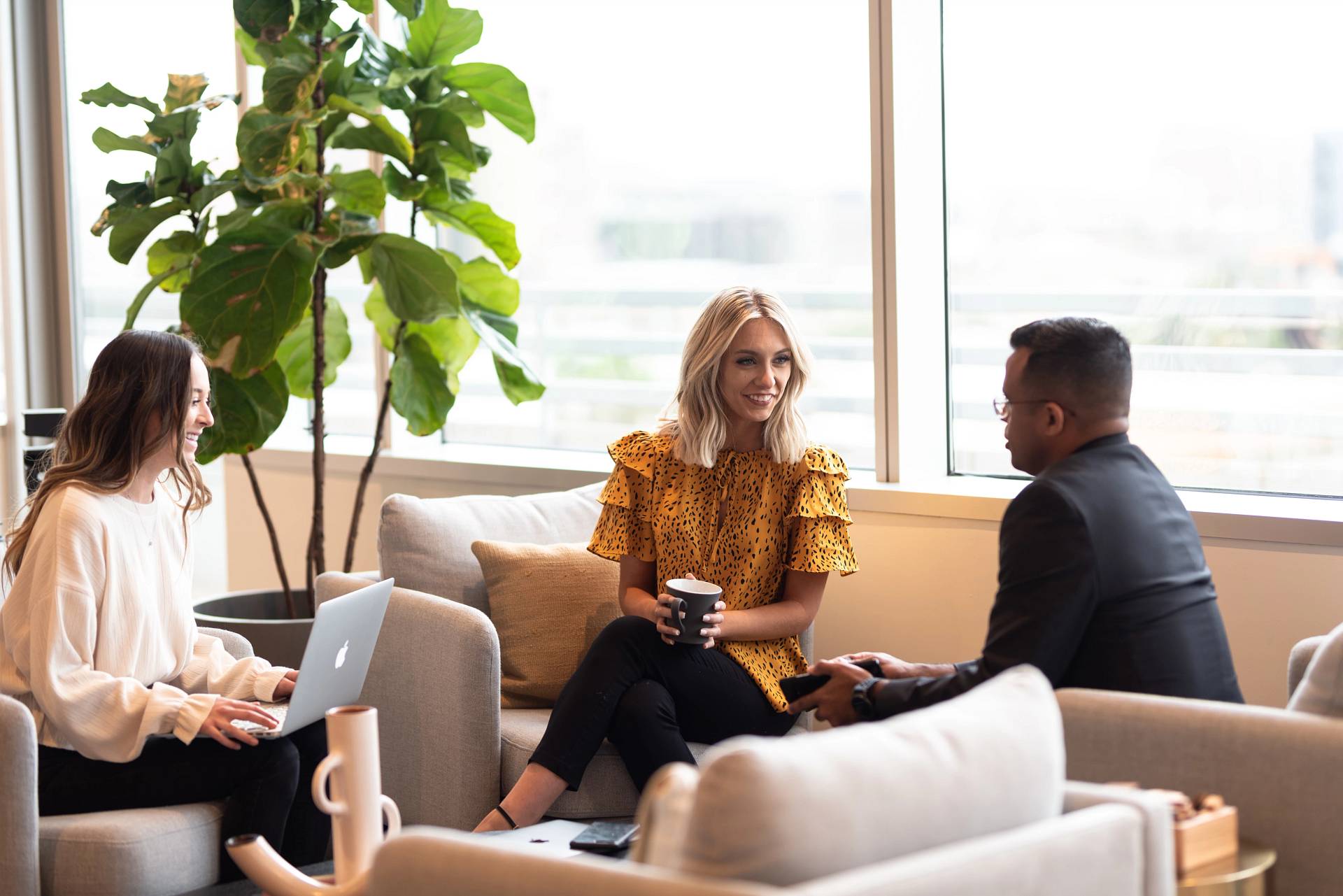 People sitting on a couch talking