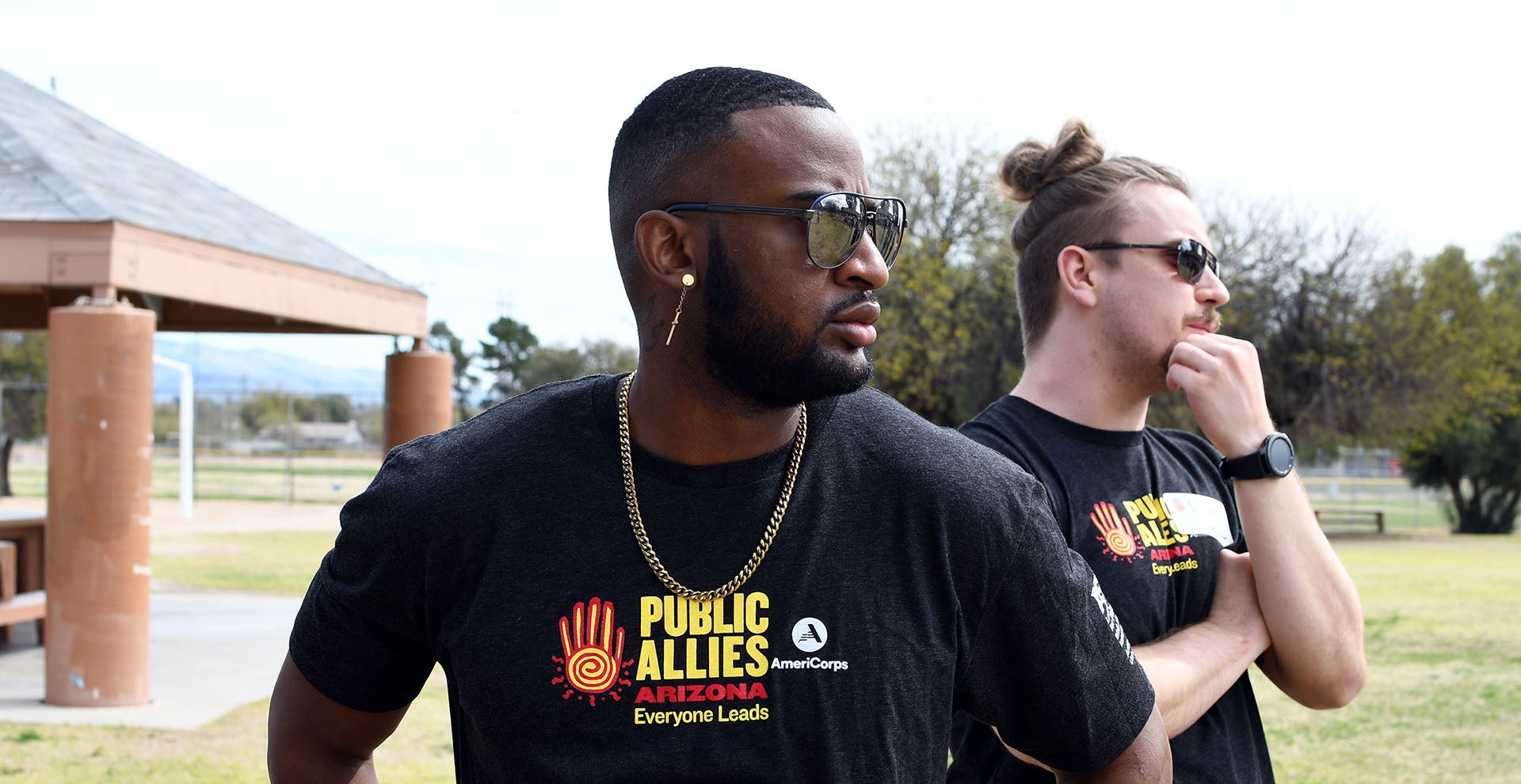 Public Allies members stand in a field