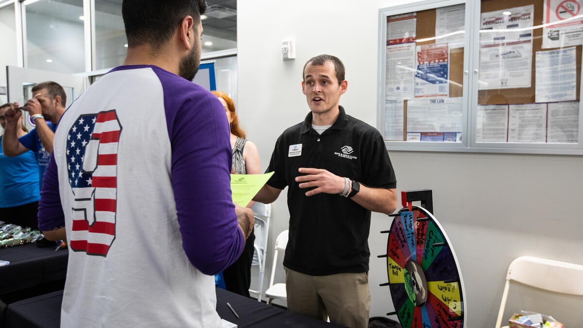 Public Allies Arizona member works at a career fair.