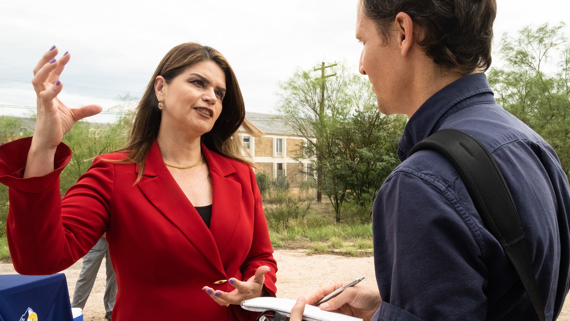 Reporter John Washington interviewing Tucson Mayor Regina Romero