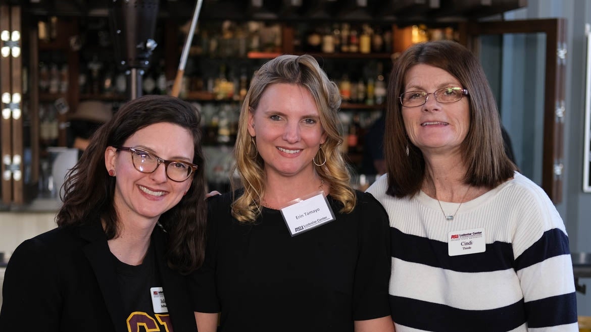 Program Manager Julie Huffman (left), Eric Tamayo (center), and Director of Professional Development Education Cindi Thiede (right) smile.