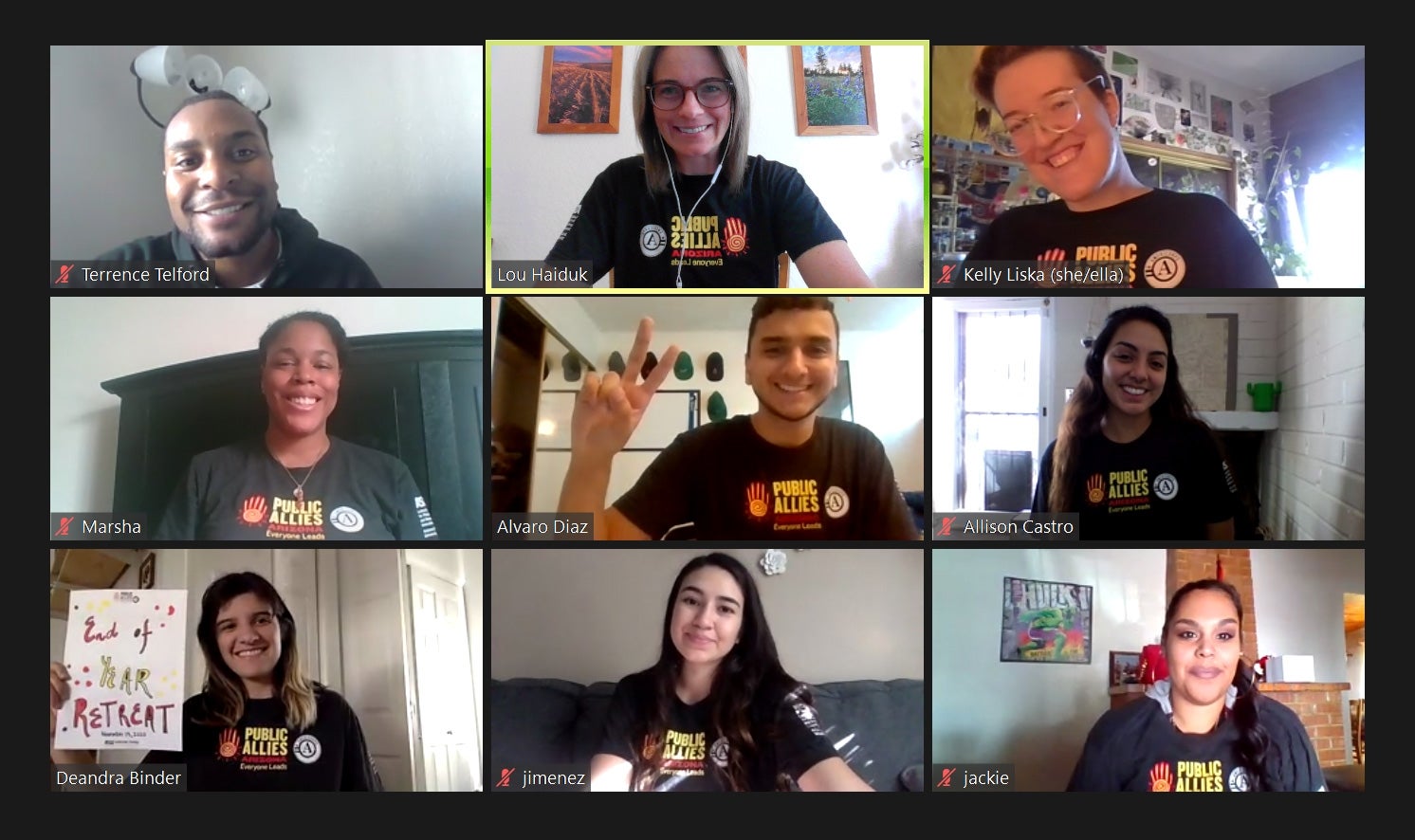 Photo of a virtual conference. 9 screens, each with one person wearing a black shirt with the "Public Allies" logo on it.