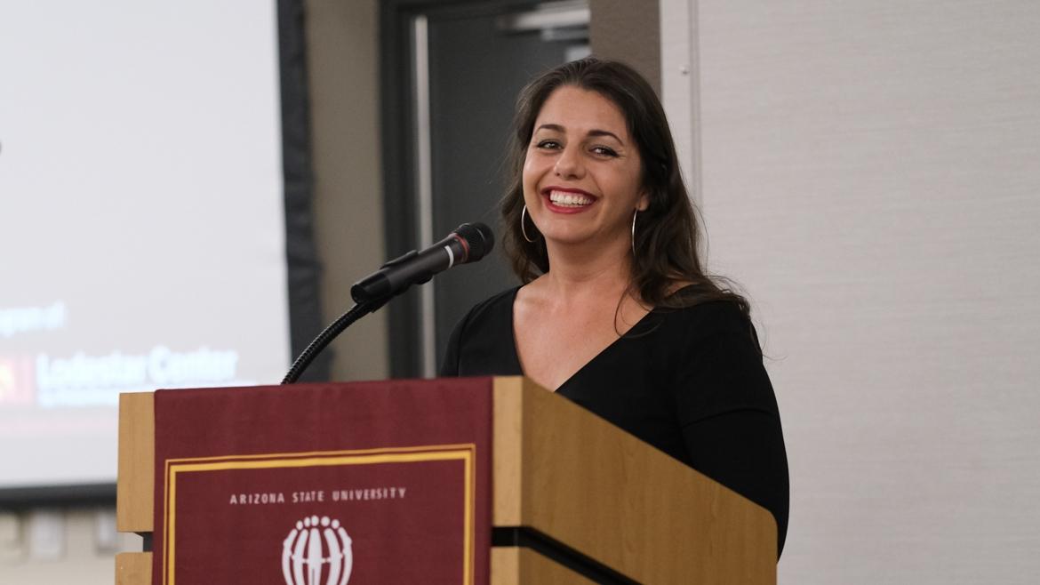 Janey Pearl Starks smiling while standing at a podium.